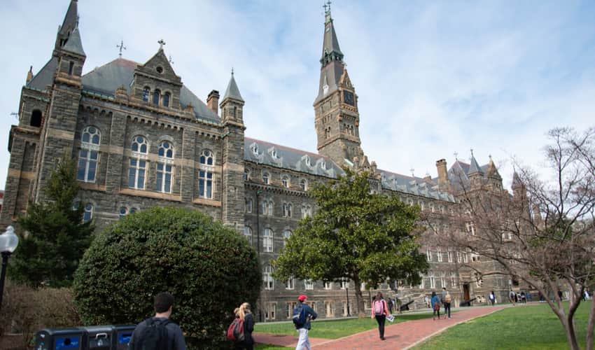 Students walking past the main building at Georgetown University 