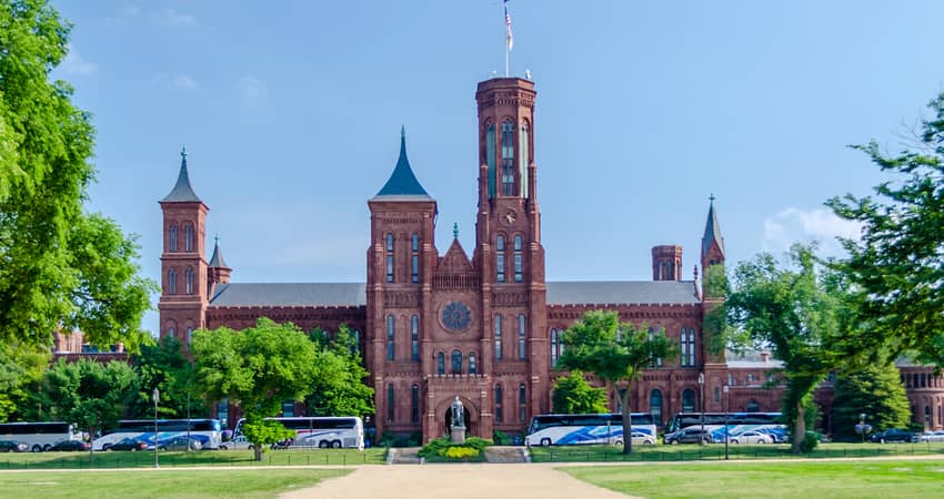 Tour buses parked outside of the Smithsonian Castle in Washington DC