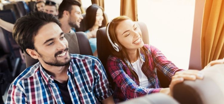 people riding together on a charter bus