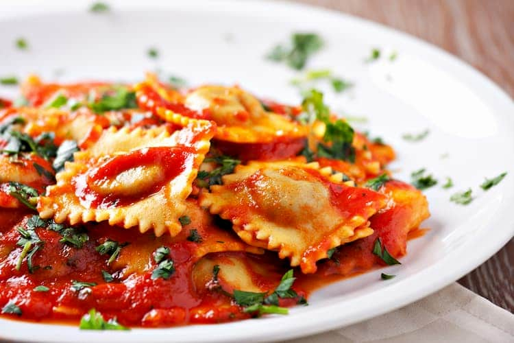 Plate of ravioli with tomato sauce