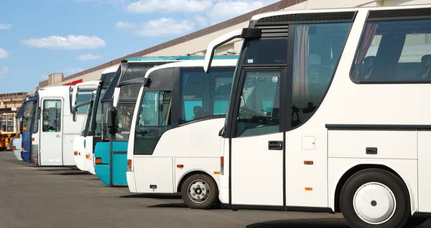 Charter buses in a parking lot