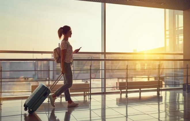 Woman with suitcase at airport