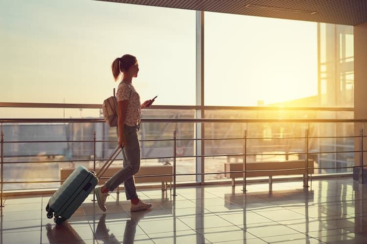 Woman with suitcase at airport