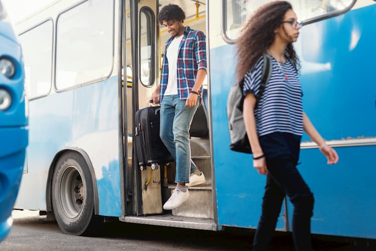 People disembarking bus