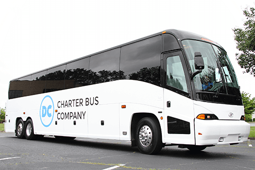 a plain white charter bus with a "DC Charter Bus Company" logo